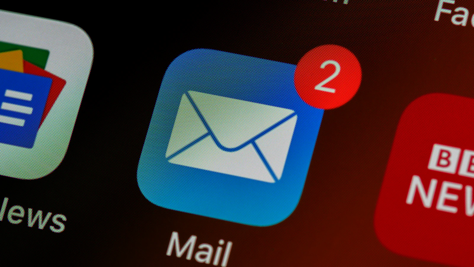 Close-up of a mail app icon on a phone screen
