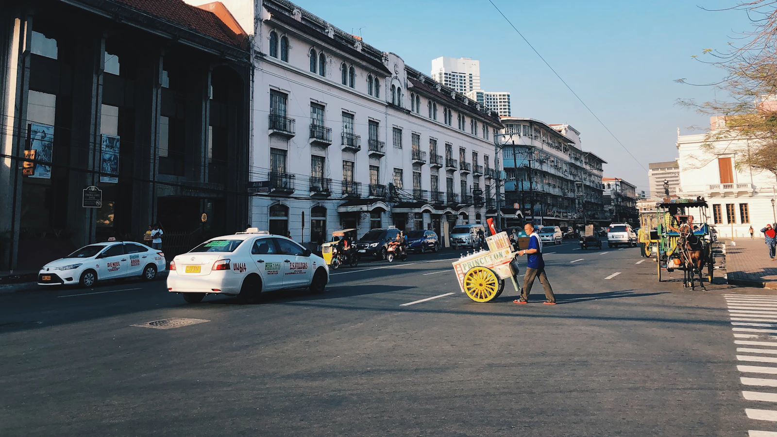 A street lined with historic buildings in Intramuros, Manila